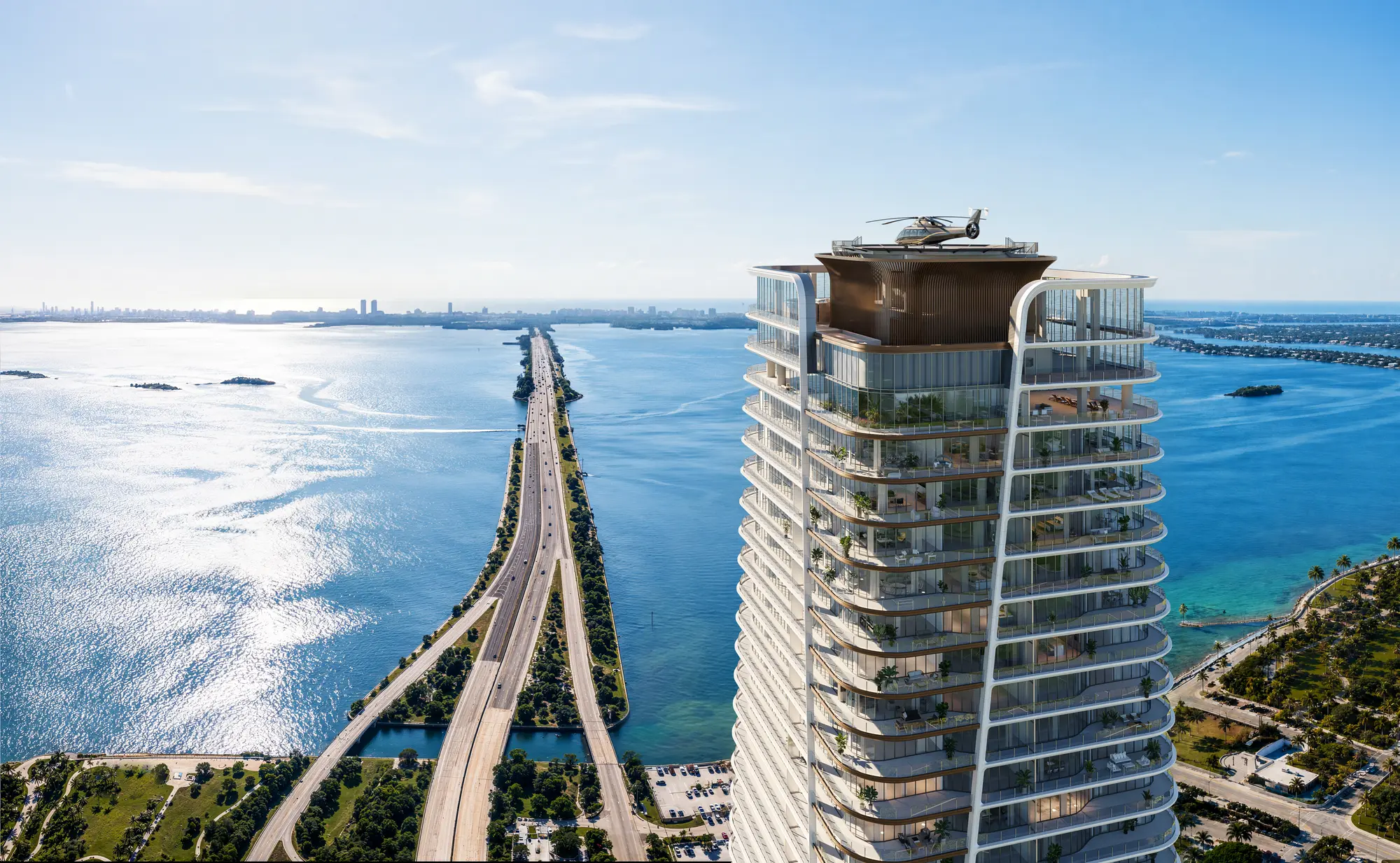 The tower’s crown and helipad above Biscayne Bay by day